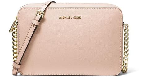 michael kors jet set travel pale pink|Michael Kors flight crossbody bag.